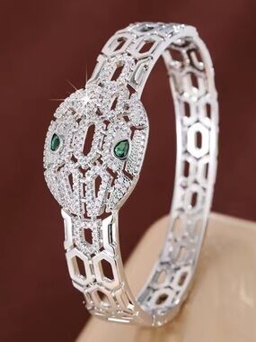 Silver-Tone Snake Head Bangle Bracelet with Green Stone Eyes